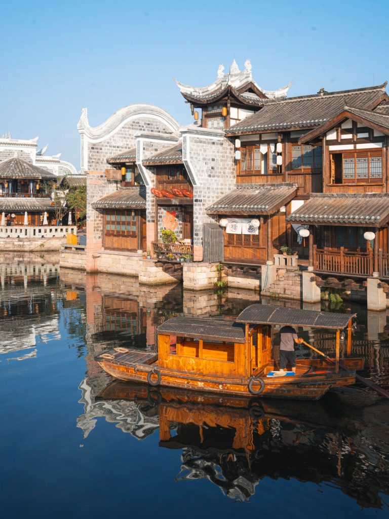 Boats on a misty river in ancient town
