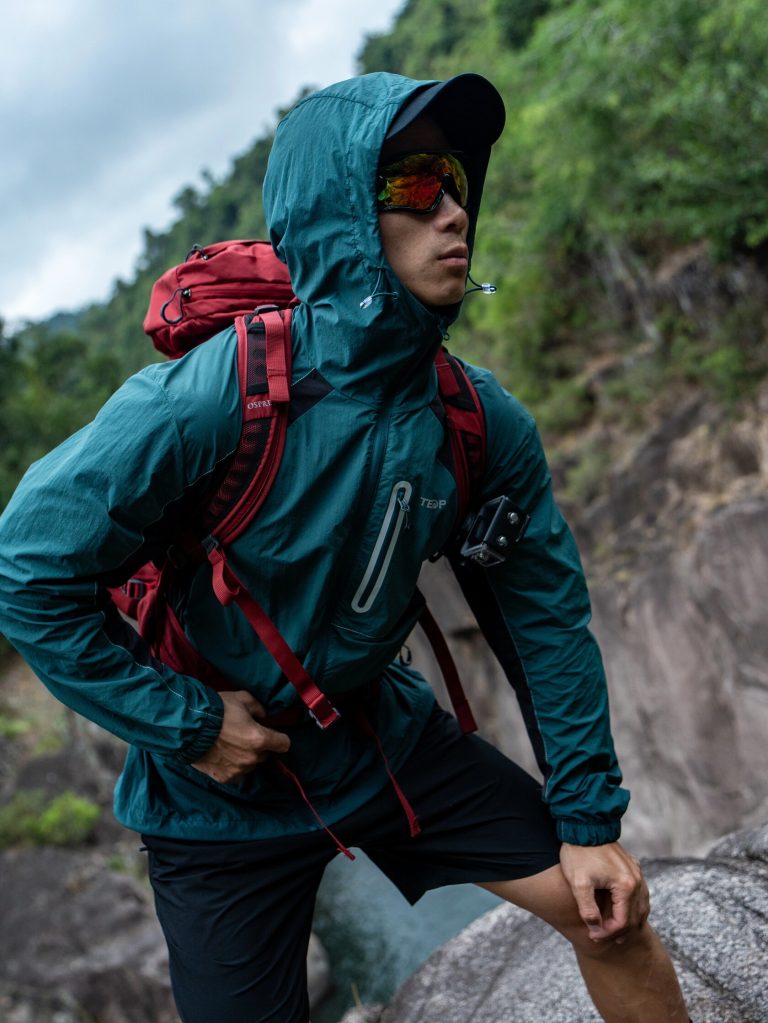 Backpacker preparing gear