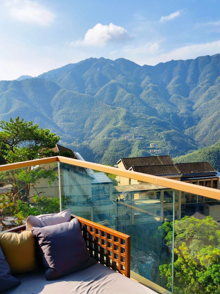 Balcony overlooking traditional rooftops and mountains