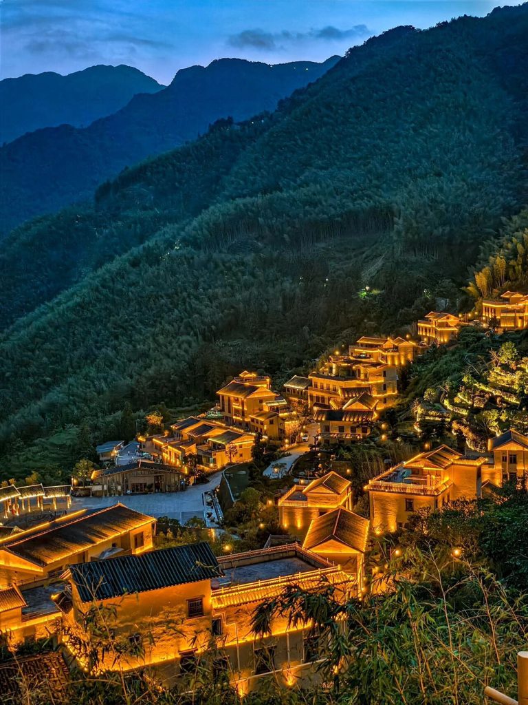 Night view of mountain village with warm yellow lights