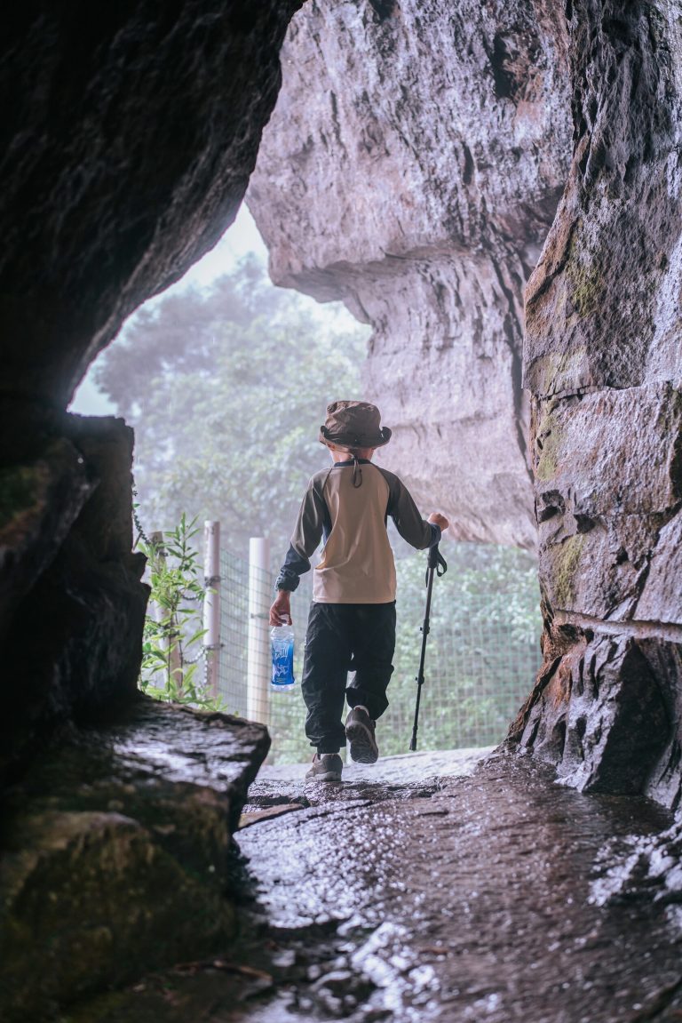Hiker in rocky crevice