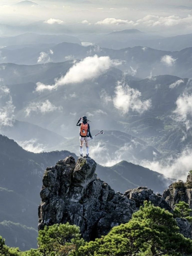Hiker overlooking mountains