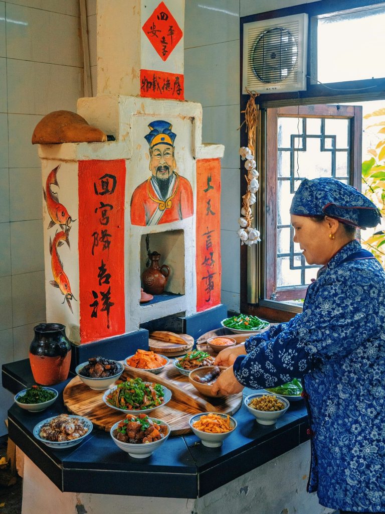 Traditional food preparation with ancestral shrine