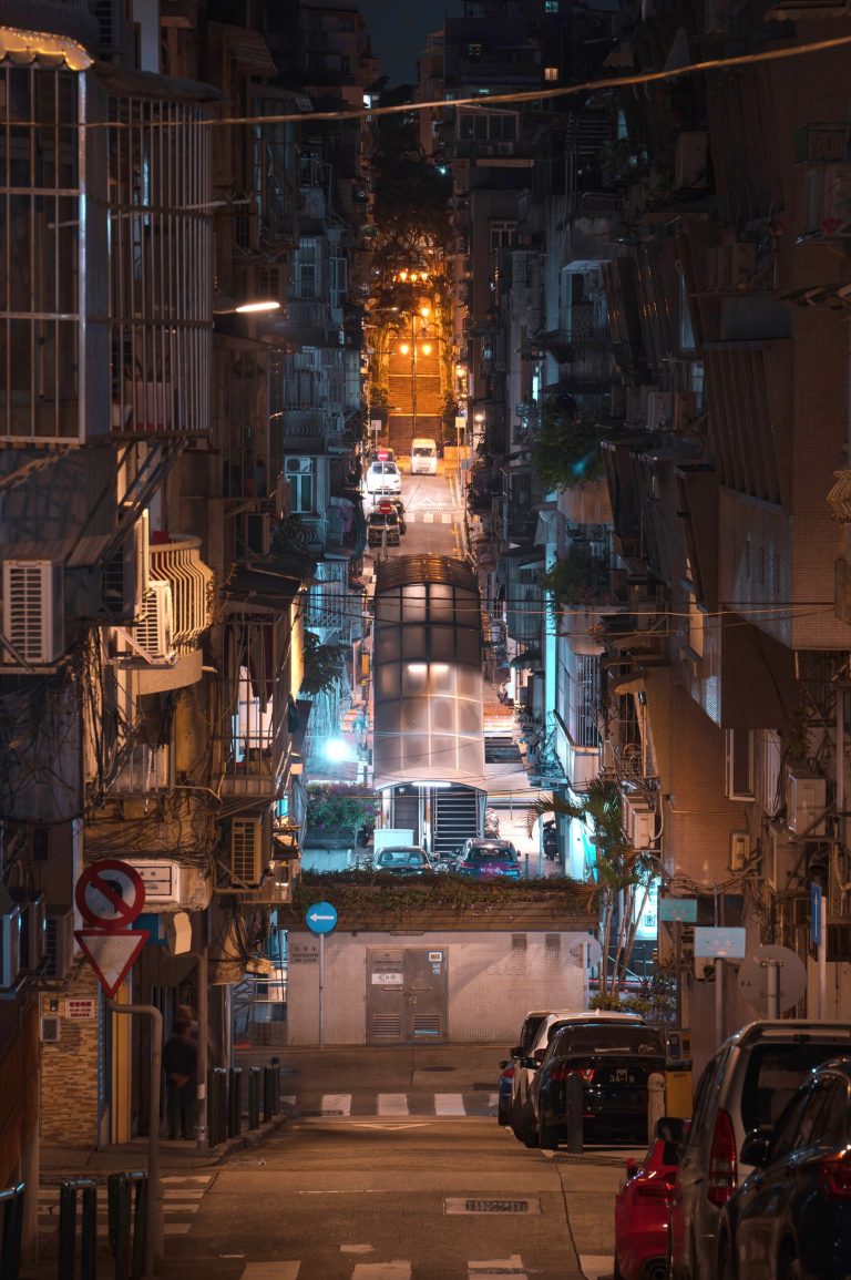 Nighttime city street with illuminated buildings