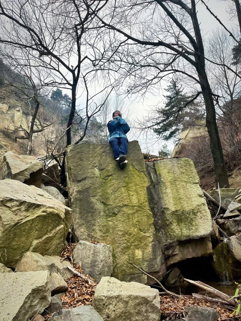 Hiker resting on mountain trail