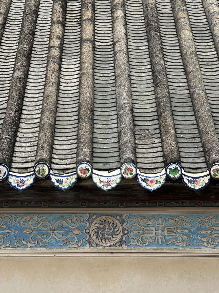 Intricate traditional roof decorations with colorful ceramic pieces