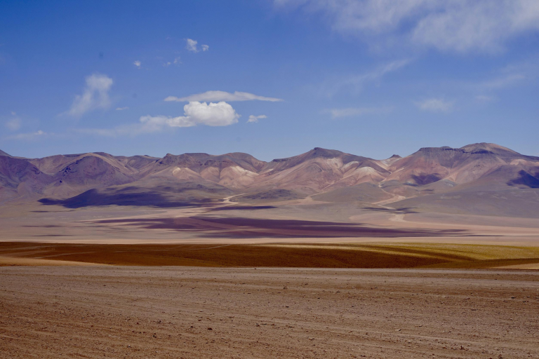 Vehicles crossing final mountain pass