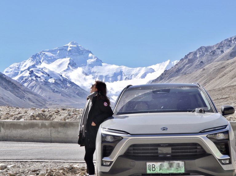 Tibet self-drive adventure with SUV against Himalayan backdrop