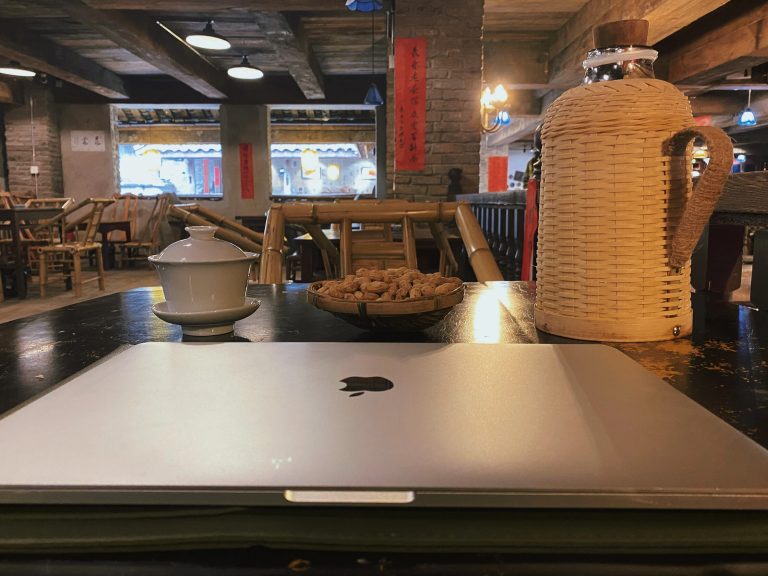 Chongqing Digital Nomad working in traditional tea house